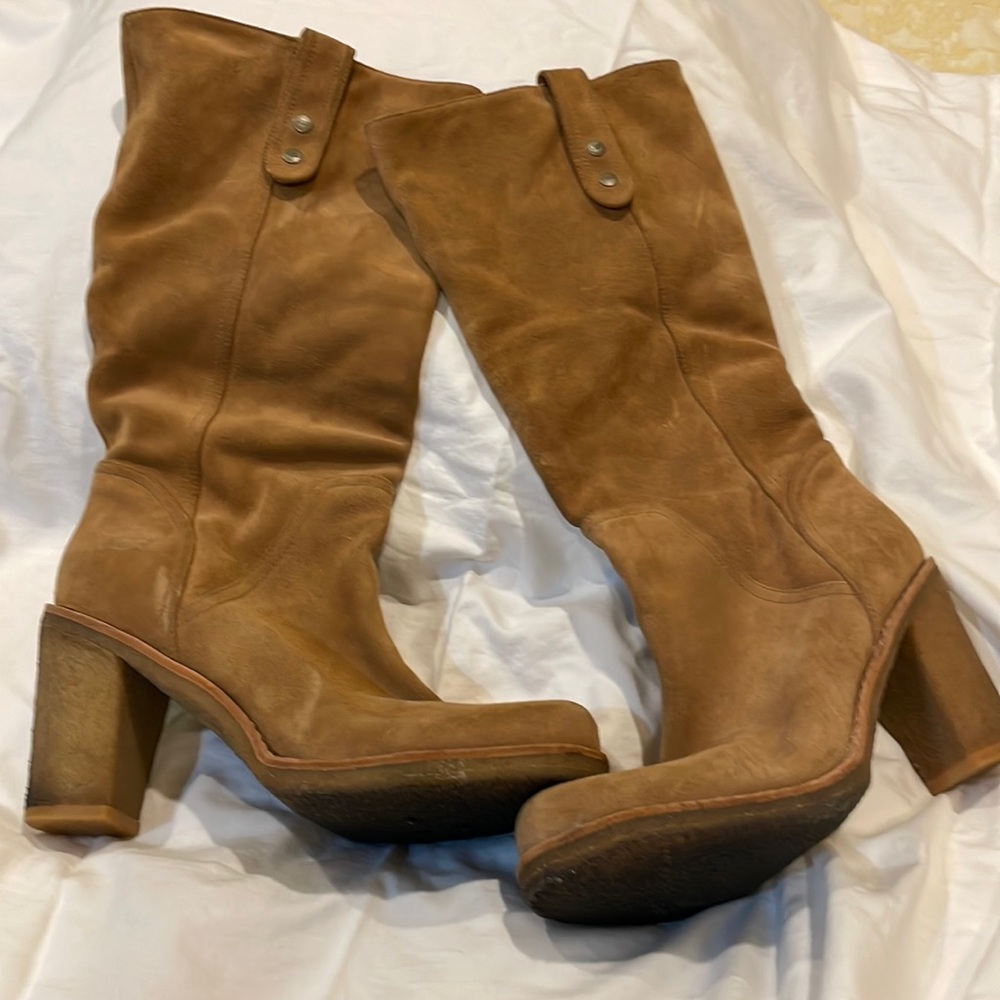 Ugg suede boots with sheepskin in the foot area.